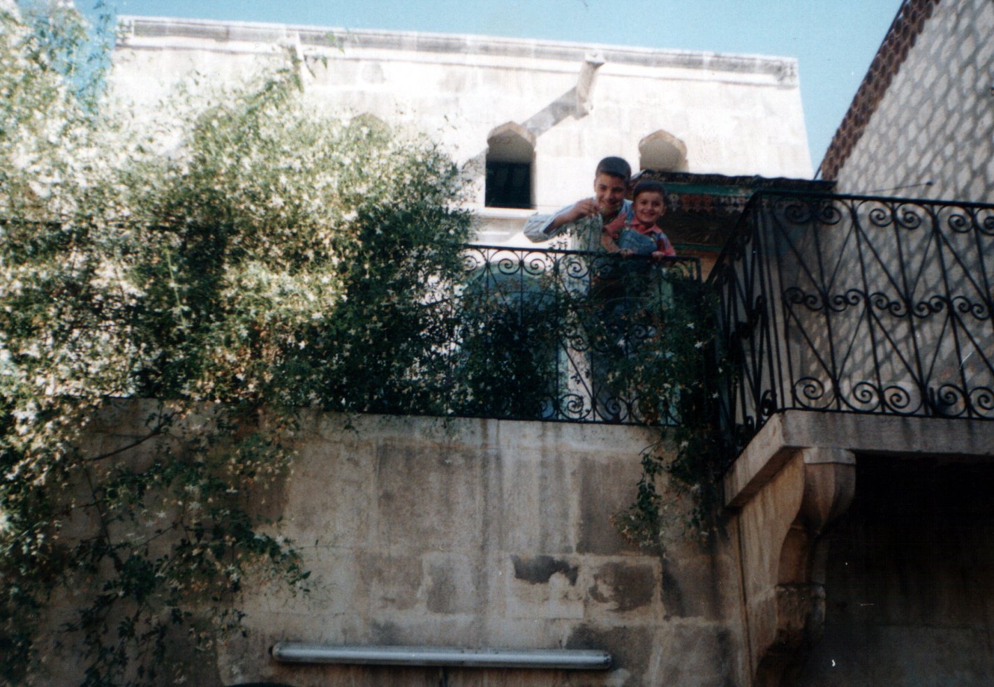 Hakam holding younger brother Shahim - around 2000